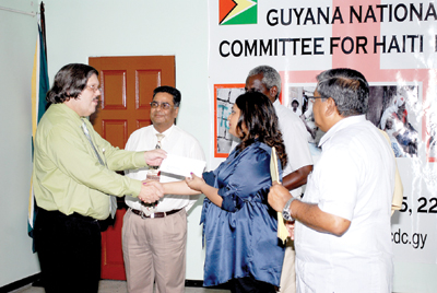 Representative of GBTI Mr. John Alves makes his presentation to Minister Manickchand. 