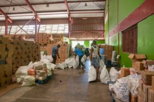 Volunteers assisting with the packing of hampers.