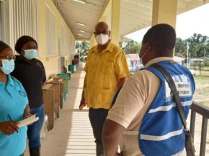 Volunteer Tashana Legall (second from left) pictured with Minister of Public Works, Juan Edghill, (second from right) and CDC Preparedness and Response Manager, Salim October (right).